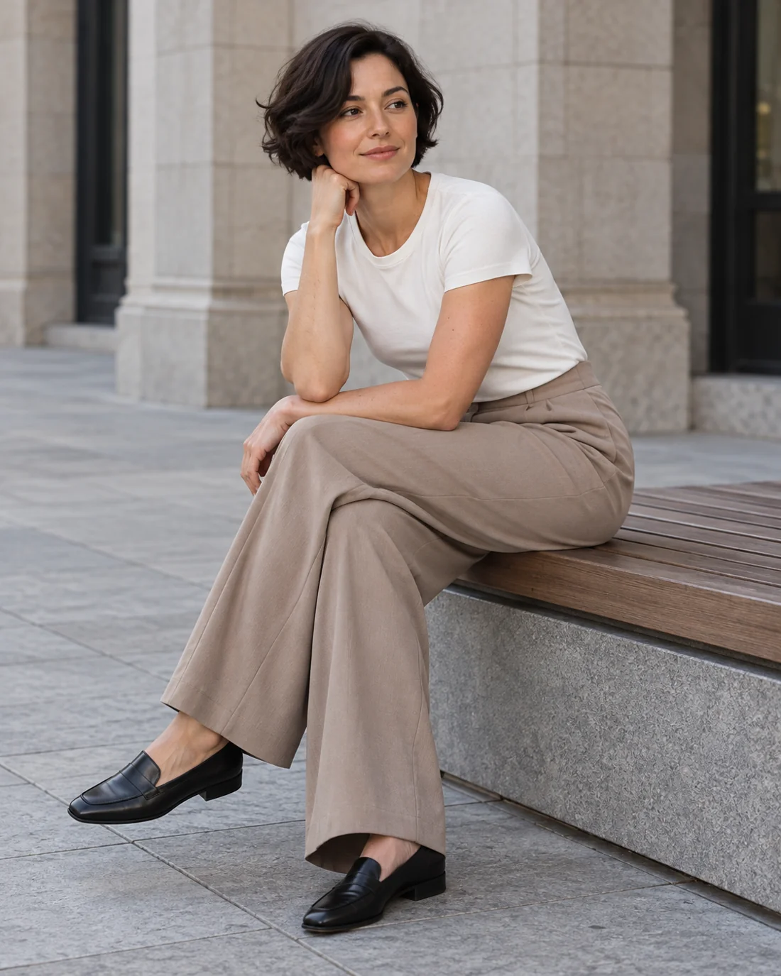 Taupe wide-leg trousers with a simple light top.
