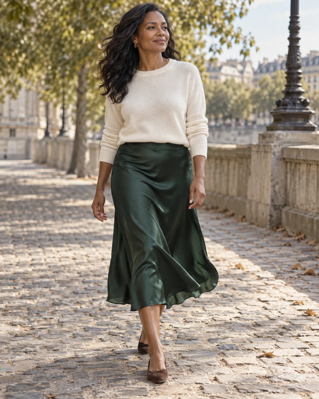 Long fluid green skirt with a light knitted jumper.
