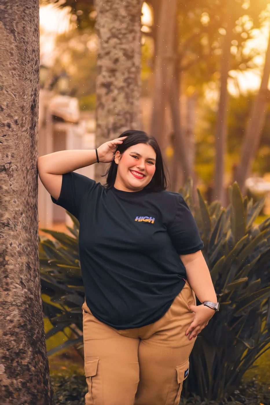 Beige cargo trousers with a black T-shirt.