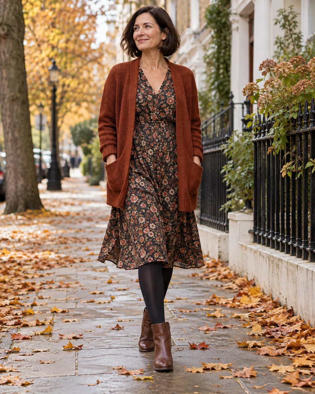 Floral summer dress with a cardigan, tights and ankle boots.