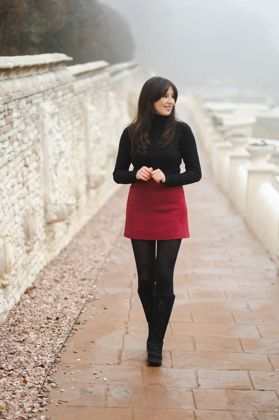 Red skirt with black tights and black boots.