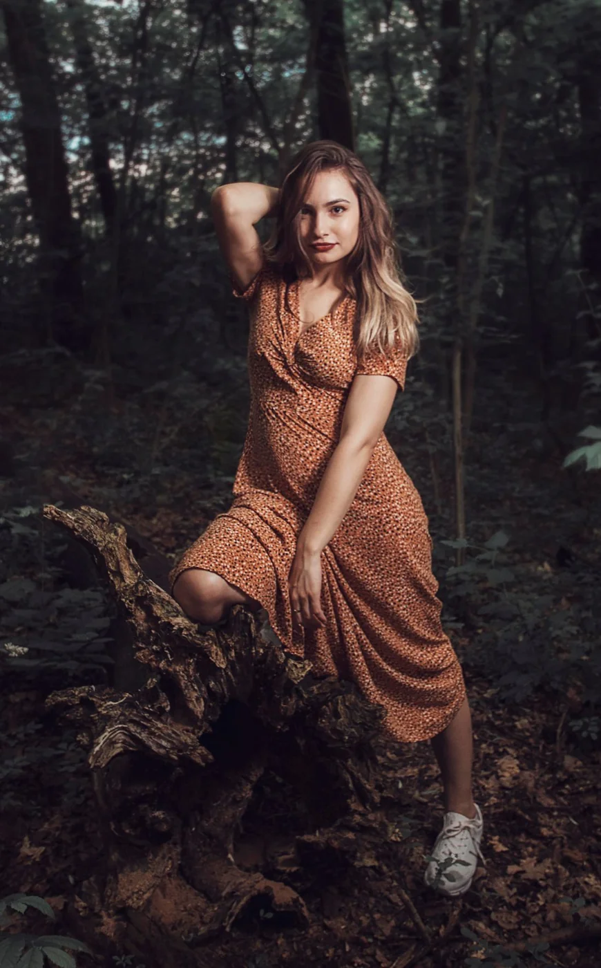 Patterned dress with light trainers.